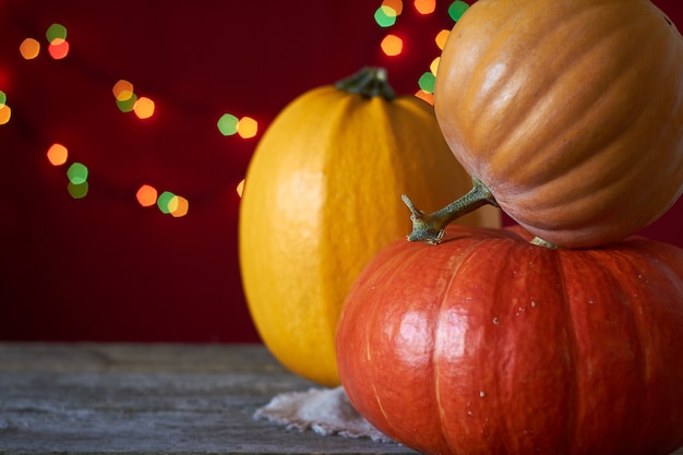 Premium Photo | Autumn background on a dark wooden surface, three