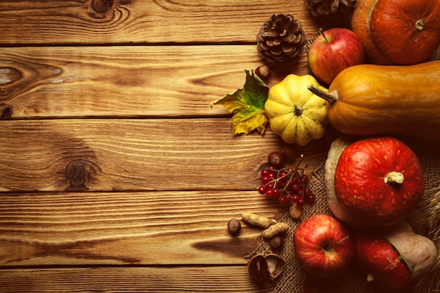 Premium Photo | Autumn background with fruit on wooden table