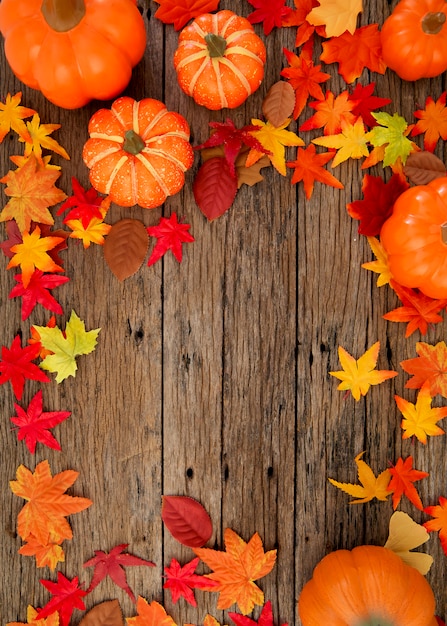 Premium Photo | Autumn leaves on wooden background