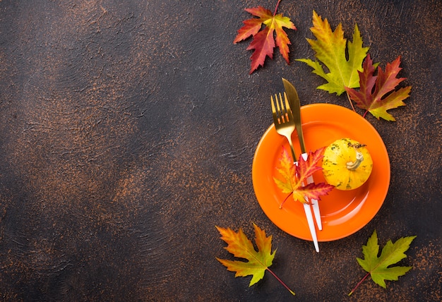 Premium Photo | Autumn table setting with leaves