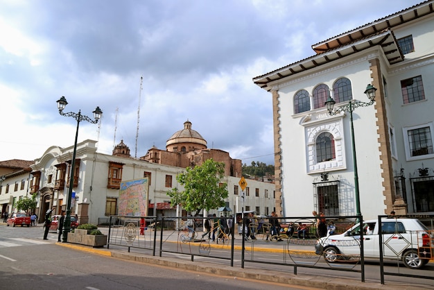 Avenida el sol, the main avenue of cusco with coricancha or temple of the sun of the incas in the distance, peru Premium Photo