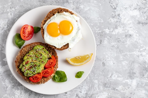 Premium Photo | Avicado toast. egg sandwich appetizer. top view