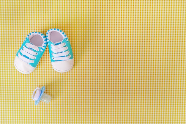 Premium Photo | Baby accessories for newborns on a colored background.