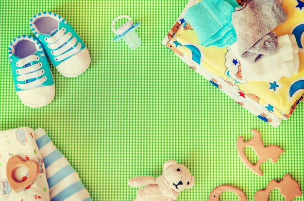 Premium Photo | Baby accessories for newborns on a colored background.