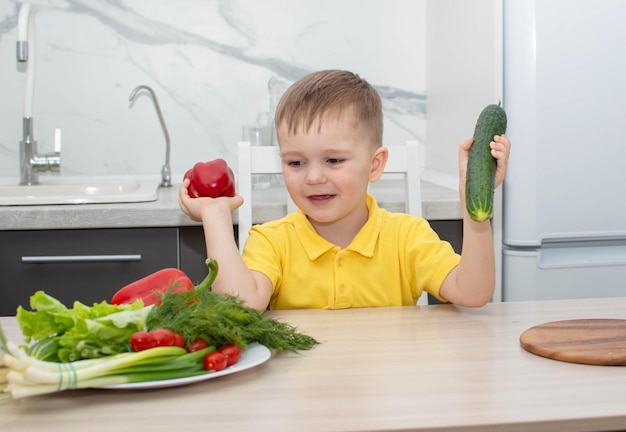 Premium Photo | Baby boy eats healthy food by showing thumbs up gesture ...