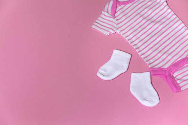 Premium Photo | Baby clothes for newborn on a pink background with copy ...