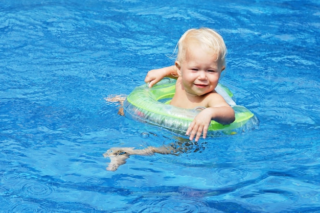 baby floating in pool