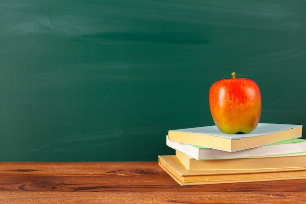 Premium Photo Back To School Apple And Books With Pencils And Blackboard 5133