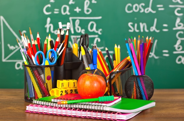 Premium Photo | Back to school - blackboard with pencil-box and school ...