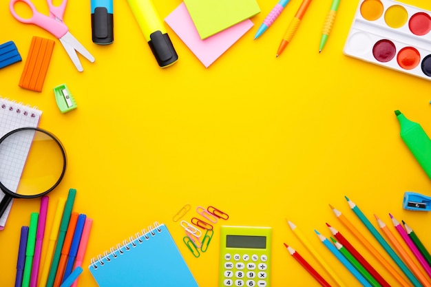 Premium Photo | Back to school concept on yellow background with copy space