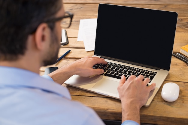 Premium Photo Back View Of Businessman Sitting In Front Of Laptop