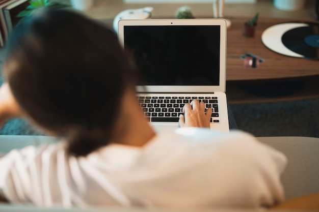 Download Free Photo | Back view woman working on laptop mock up