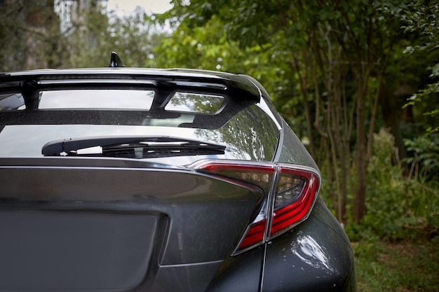 Download Premium Photo | Back window of black car parked on the ...