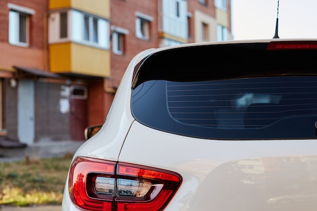 Download Premium Photo Back Window Of White Car Parked On The Street In Summer Sunny Day Rear View Mock Up For Sticker Or Decals