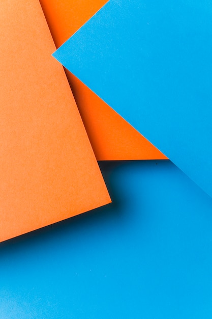 青とオレンジ色の紙の背景 無料の写真