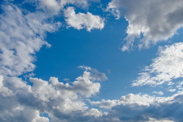 Premium Photo | Background of blue sky with white and gray clouds.