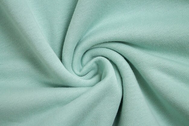 Premium Photo | Background of light green fabric sample from above view