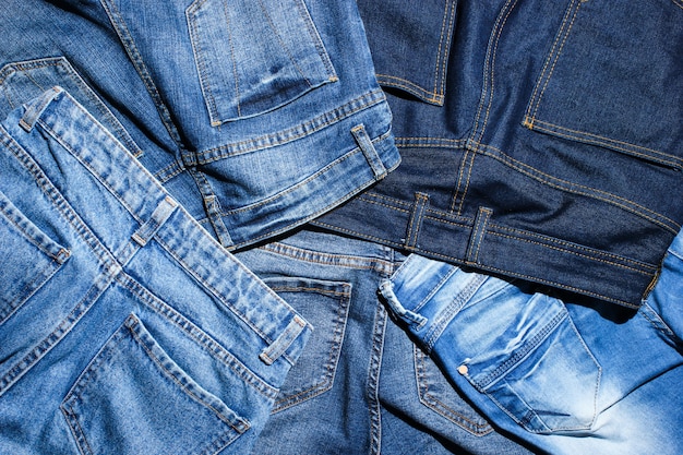 Premium Photo | Background of many jeans pants