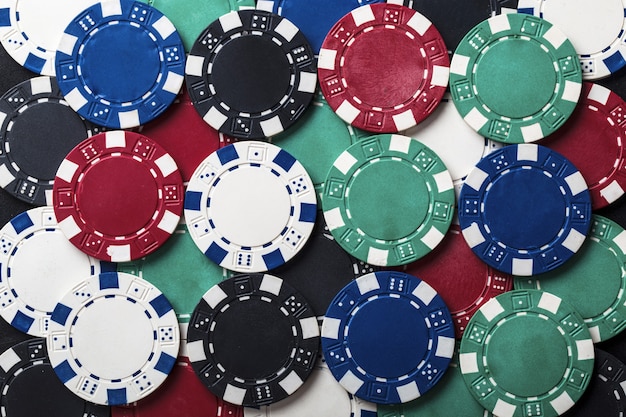 Premium Photo | Background of set of colored chips for playing poker