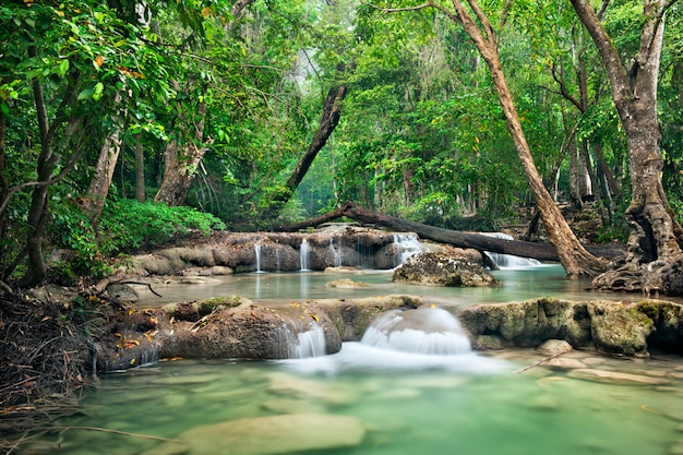 Premium Photo | Background of streaming waterfall in national park in ...