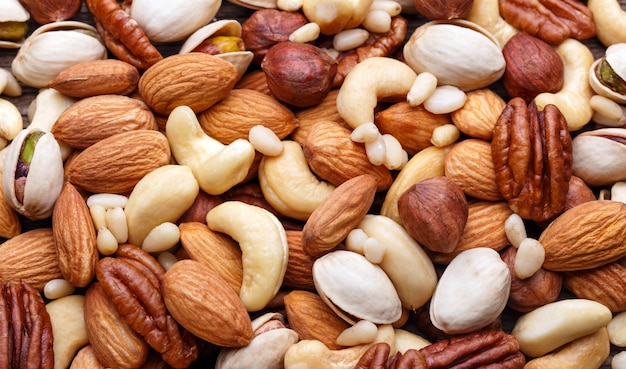 Premium Photo | Background texture of assorted mixed nuts