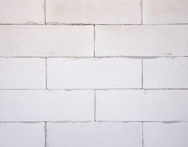 プレミアム写真 白色軽量コンクリートブロック 発泡コンクリートブロックの背景テクスチャ