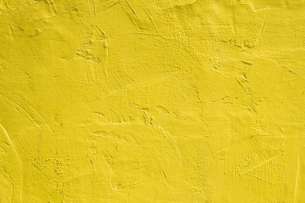 黄色のペンキで壁のテクスチャの背景 プレミアム写真