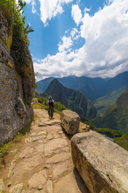 Premium Photo | Backpacker exploring machu picchu trails, peru