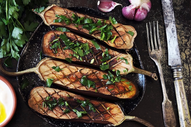 Premium Photo | Baked eggplant with herbs and garlic