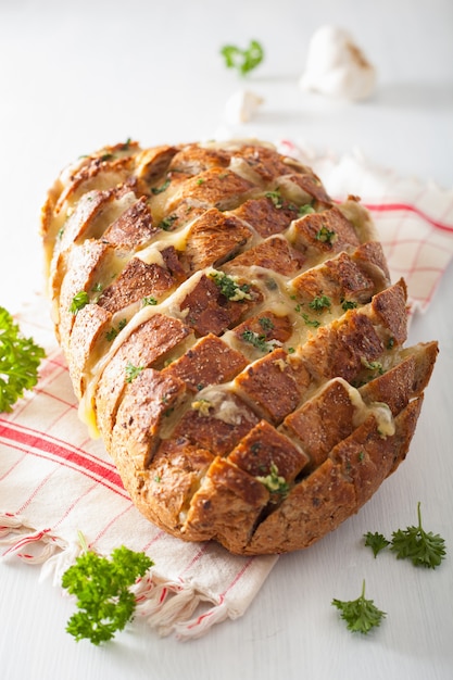 Premium Photo | Baked party bread with melted cheese butter herbs