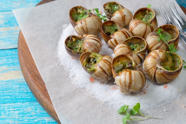 Premium Photo | Baked snails with garlic butter and fresh herbs