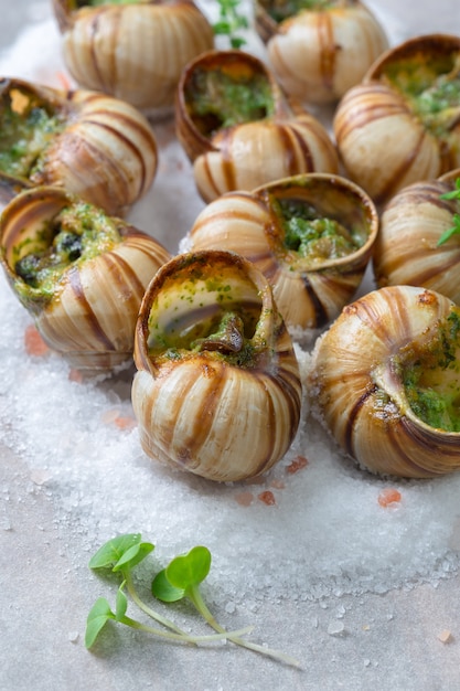 Premium Photo | Baked snails with garlic butter and fresh herbs