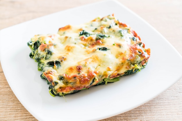 Premium Photo | Baked spinach with cheese