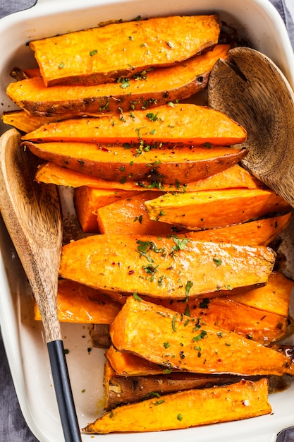 Premium Photo Baked Sweet Potato Slices With Spices In Oven Dish Healthy Vegan Food Concept 