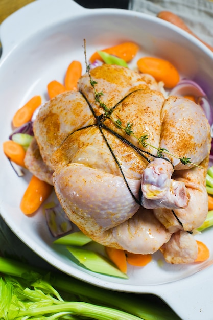 Premium Photo A Baking Sheet With A Piece Of Raw Chicken In The Spices