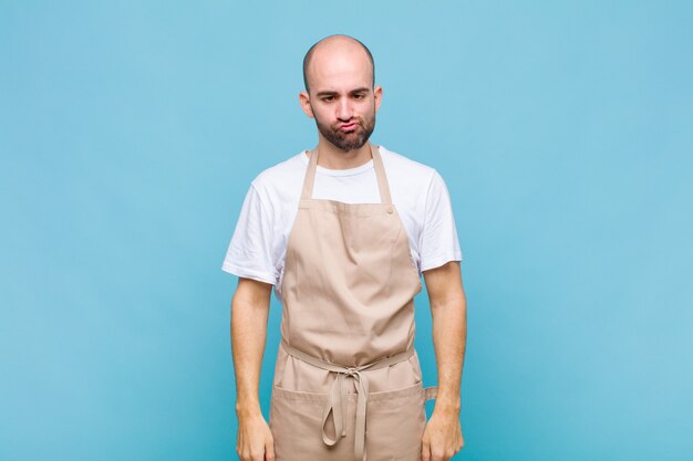 Premium Photo | Bald man looking goofy and funny with a silly cross ...