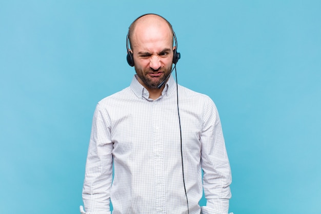 Premium Photo | Bald man looking goofy and funny with a silly cross ...