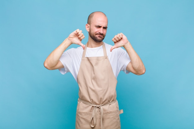 Premium Photo | Bald man looking sad, disappointed or angry, showing ...