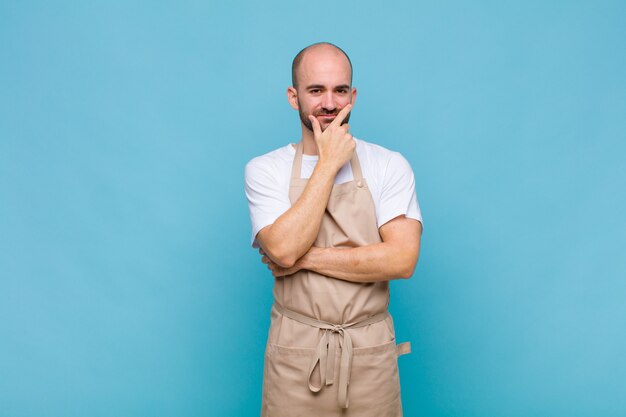 premium-photo-bald-man-looking-serious-thoughtful-and-distrustful