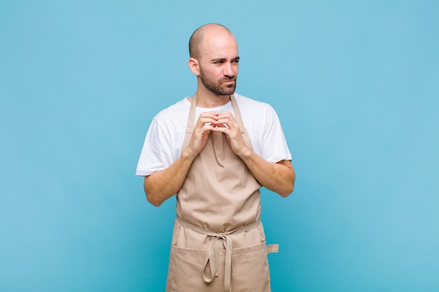 Premium Photo | Bald man scheming and conspiring, thinking devious ...