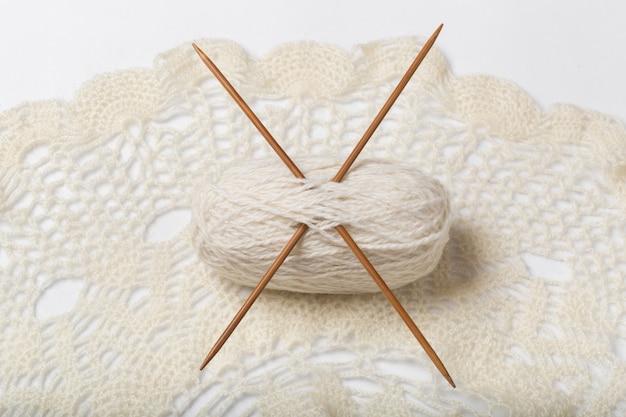 ball of yarn with knitting needles