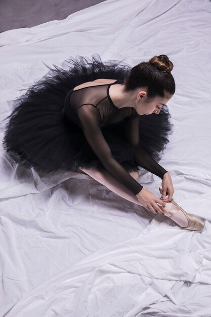 ballerina putting on shoes