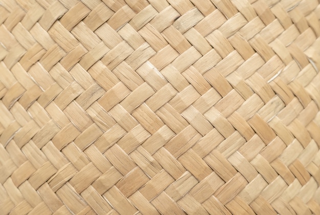背景として使用するための竹かごのテクスチャです 編まれたバスケットパターンと質感 プレミアム写真