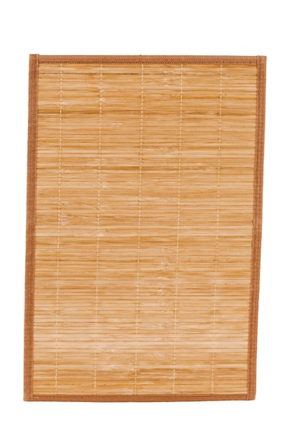 Premium Photo | Bamboo straw serving mat isolated over white background.