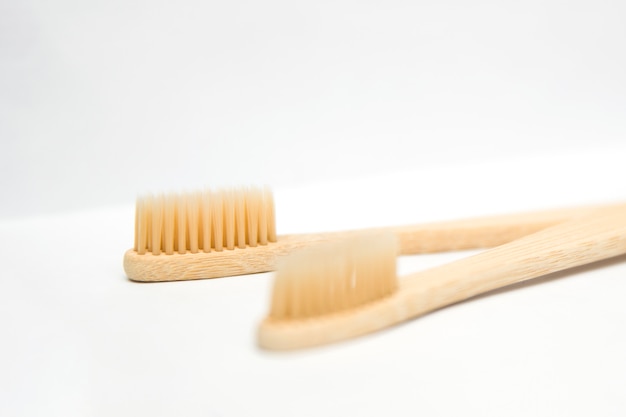 Bamboo toothbrushes isolated on the white background | Premium Photo