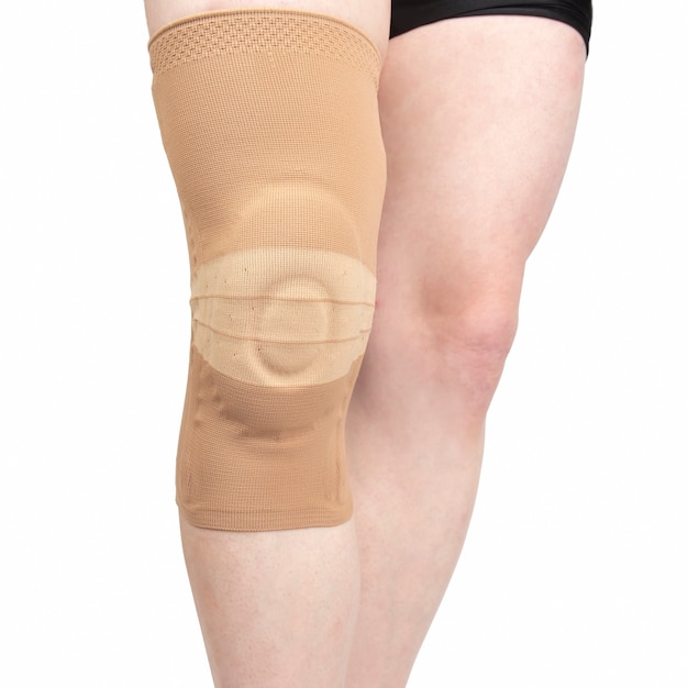 Premium Photo | Bandage for fixing the injured knee of the human leg on ...