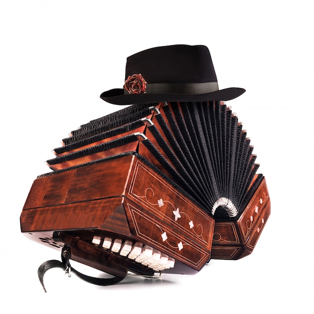 Premium Photo Bandoneon Tango Instrument With A Male Hat On Top On White