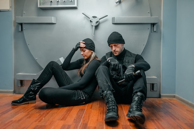 Premium Photo | Bank Robbery, Male And Female Robbers In Black Uniform ...