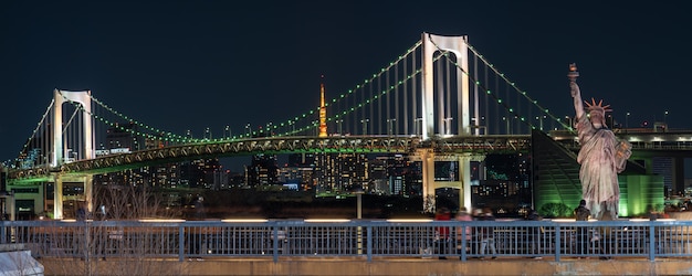 Premium Photo Banner Of Statue Of Liberty And Rainbow Bridge At Night Time Located At Odaiba Tokyo Japan