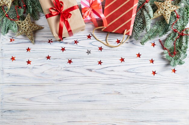 Premium Photo Banner With Cristmas Presents And Decorations On White Wooden Background With Sparkling Stars